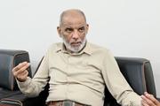 　インタビューに応じるホサム・バドラン氏（共同）