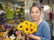 「プロギングで町を明るくしたい」と話す林美鈴さん＝同市若宮町、花んな