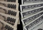 　１万円札と百ドル紙幣（ロイター＝共同）