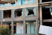 　損壊した建物＝２１日、シリア南部スワイダ県（ロイター＝共同）