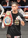 ５回ＴＫＯ勝ちを収め、ＷＢＯアジア・パシフィックスーパーフライ級王者に輝いた田中恒成＝後楽園ホール