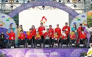 　愛知・名古屋アジアパラ大会の歓迎式典に参加した日本選手団＝１５日、名古屋港のガーデンふ頭