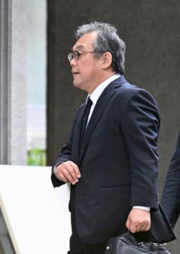 　口頭弁論のため札幌地裁に向かう桂田精一被告＝９日午前